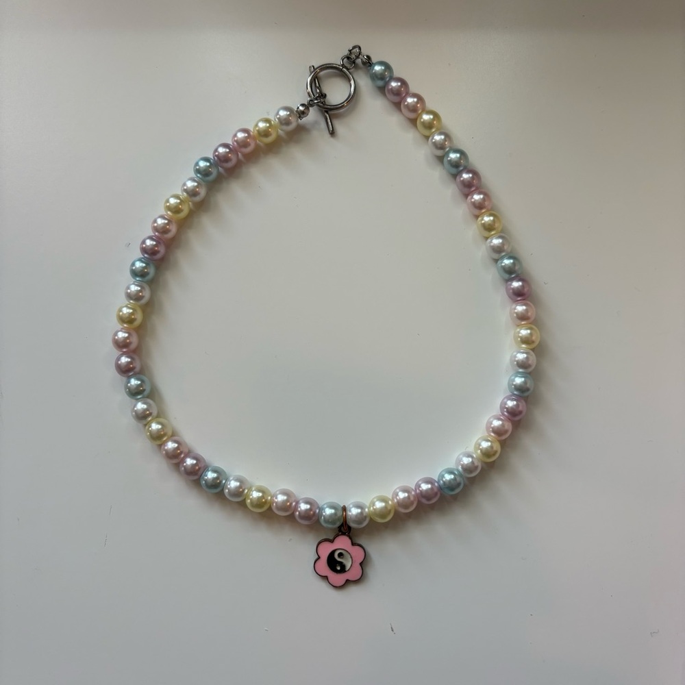 Pastel pearl choker with yin yang flower charm